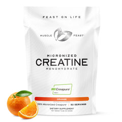 Muscle Feast Creapure micronized creatine powder jar showing German-made purity and easy mixing.