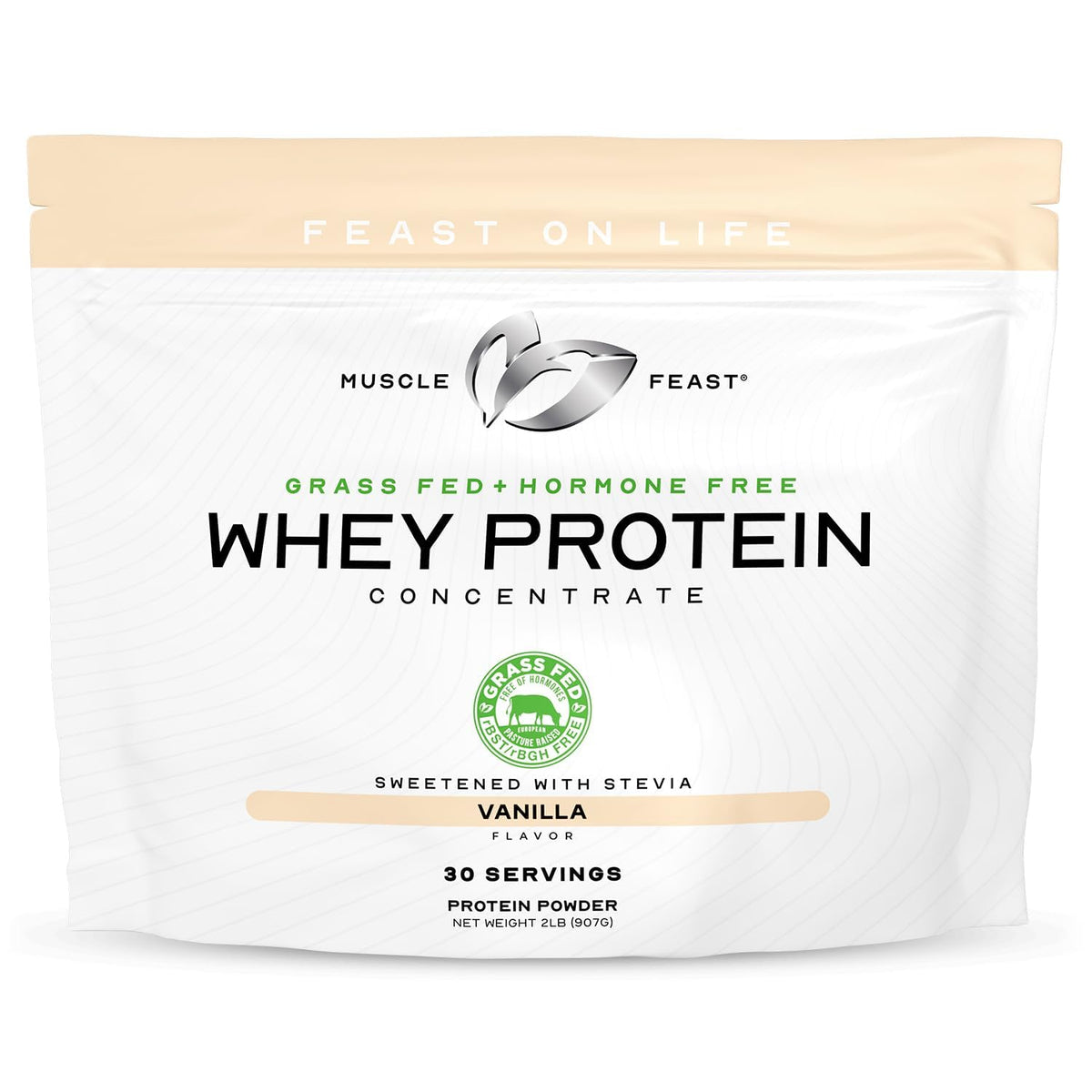 Muscle Feast grass-fed whey concentrate vanilla tub ready for a protein shake