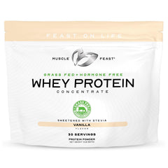 Muscle Feast grass-fed whey concentrate vanilla tub ready for a protein shake