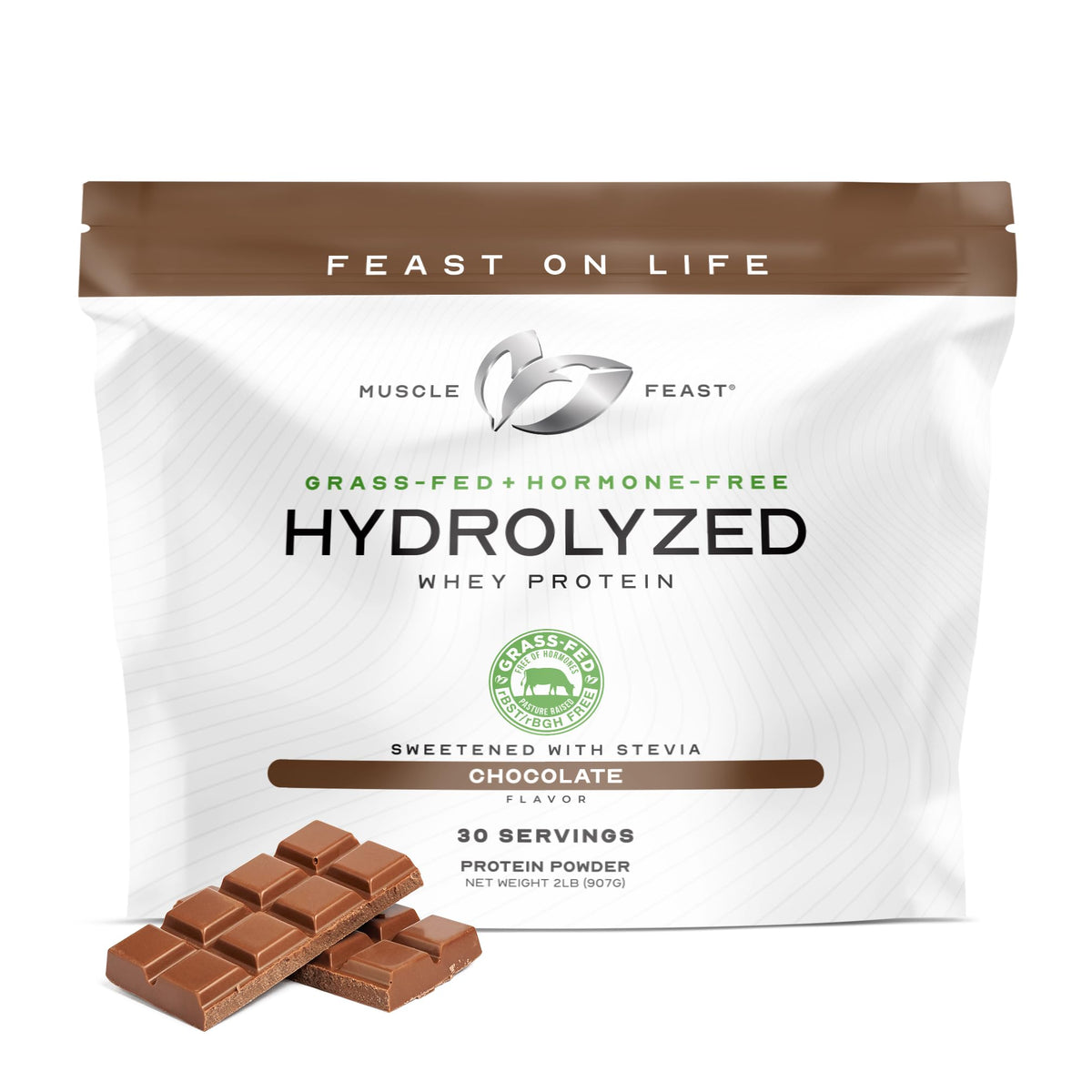 Muscle Feast Hydrolyzed Whey packaging on display highlights grass-fed, hormone-free formula.