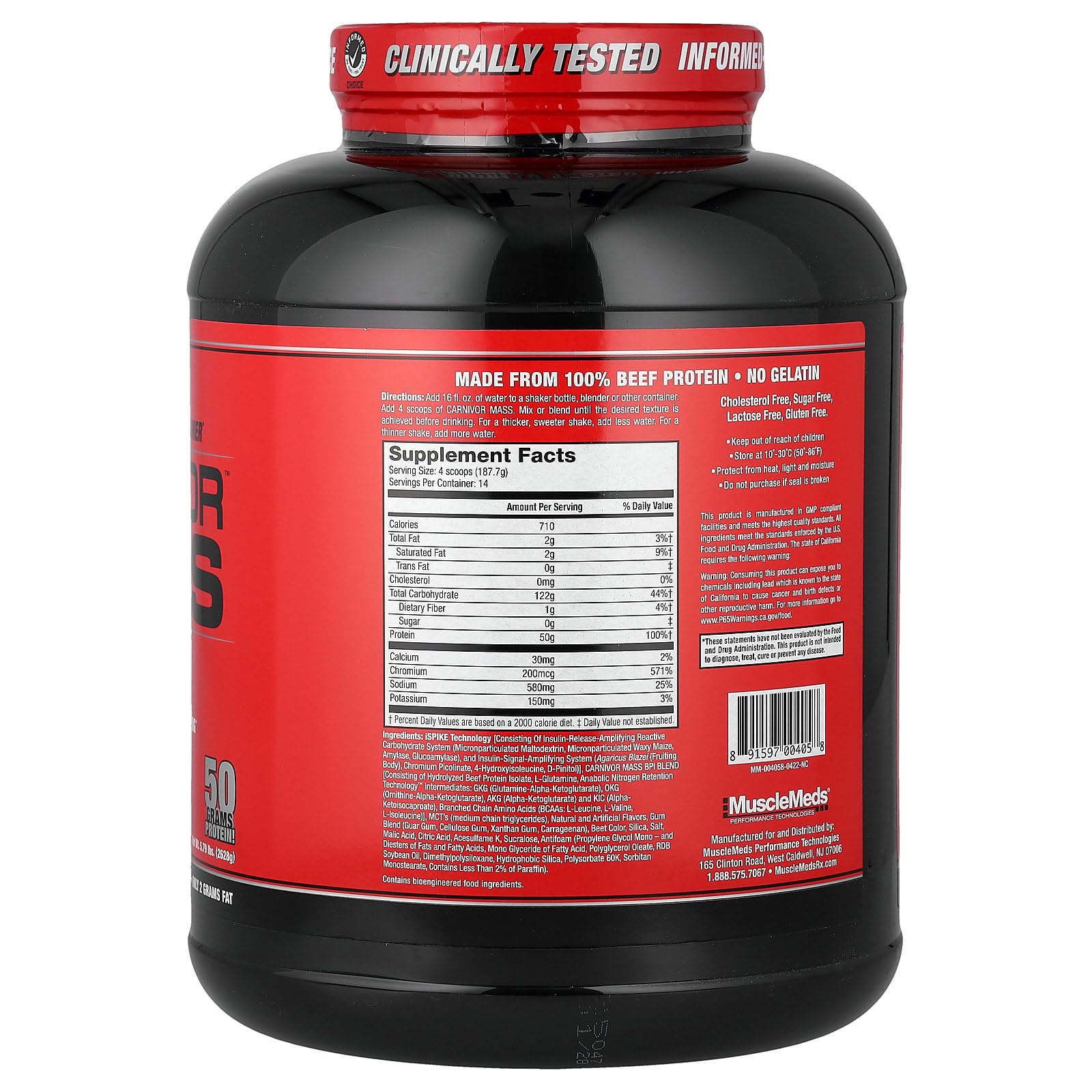 MuscleMeds Carnivor Mass scoop beside tub for easy mixing.