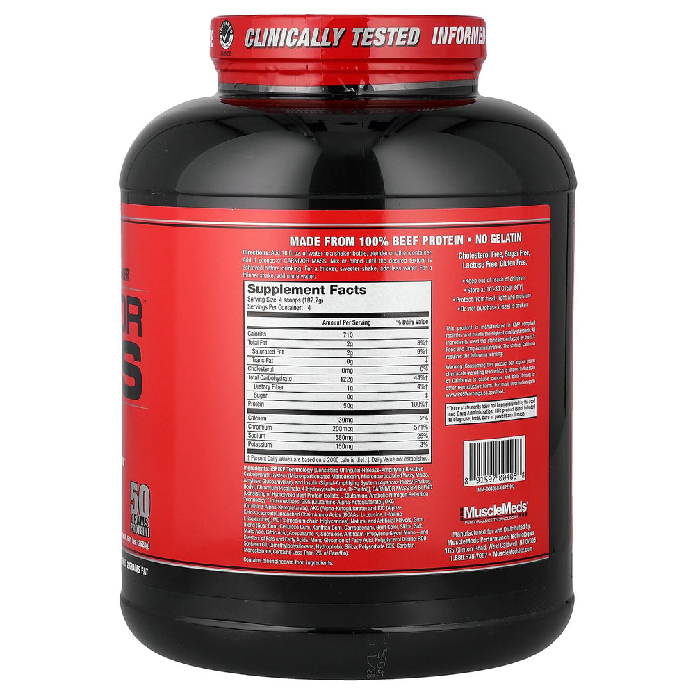 MuscleMeds Carnivor Mass scoop beside tub for easy mixing.