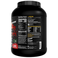 Mutant Hardcore ISO Whey scoop beside a glass ready for morning routine.