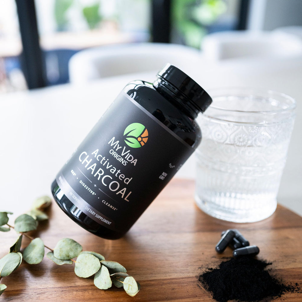 My Vida Origins capsules on table for easy daily gut support.