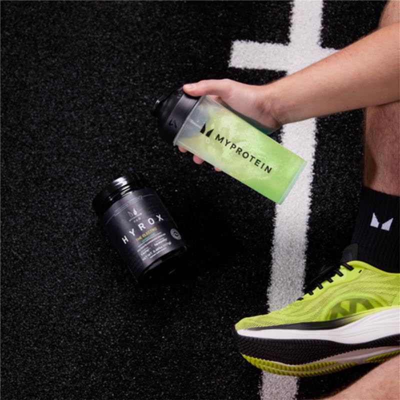 Myprotein HYROX Electro glass drink captures refreshing hydration during breaks.
