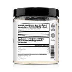 NAKED Colostrum Powder dissolving in a glass showing neutral taste blend.