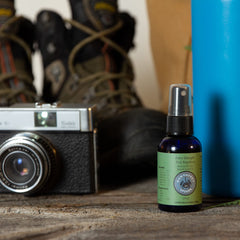 Close-up of Nantucket Spider Tick Repellent Spray bottle showing lightweight, non-greasy feel.