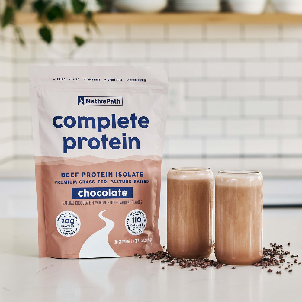 Glass of shake with NativePath chocolate protein powder, showcasing rich flavor and protein source