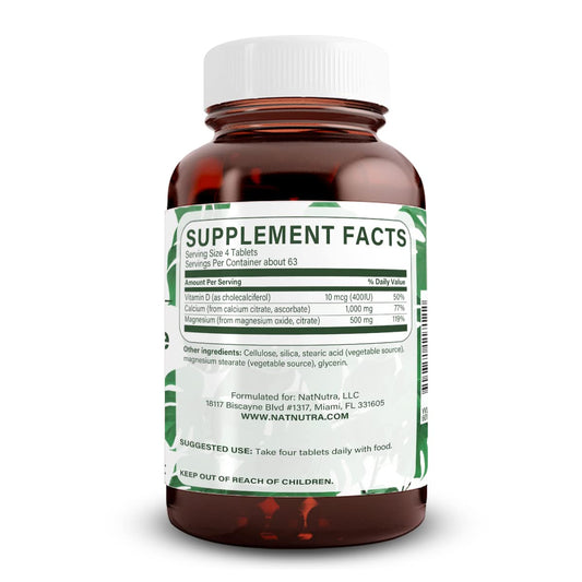 Close-up of Natural Nutra Cal-Mag Citrate tablets highlighting vegan formula for bone health.