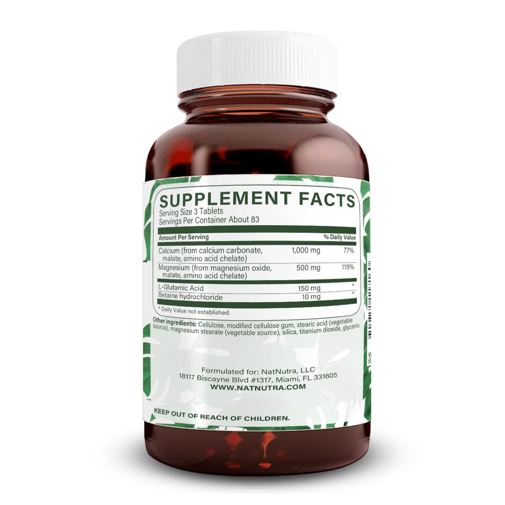 Natural Nutra calcium magnesium capsules close-up showing supplement texture