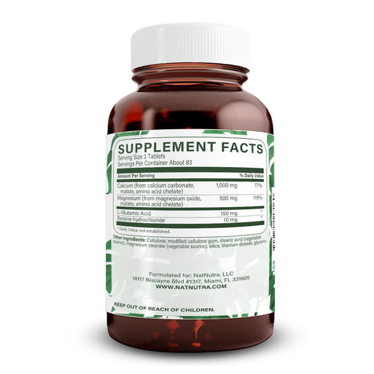 Natural Nutra calcium magnesium capsules close-up showing supplement texture