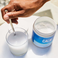 Measuring scoop with CALM powder in use