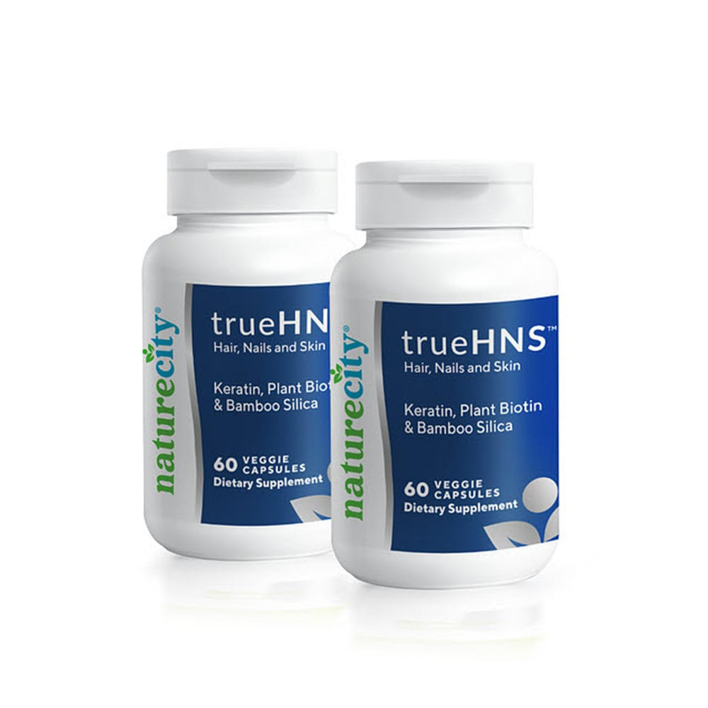 NatureCity True-HNS bottle demonstrates keratin support for stronger, shinier hair.