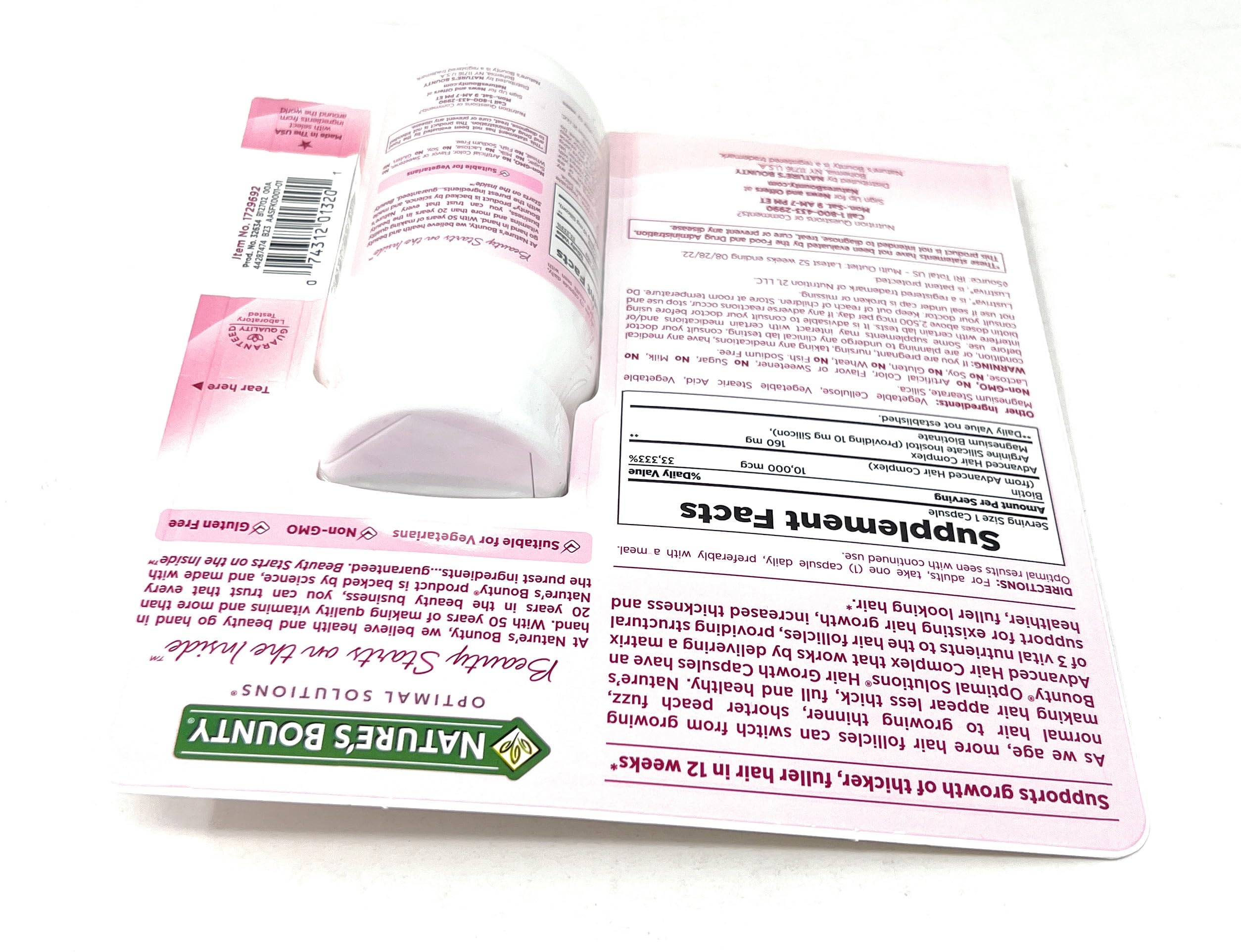 Nature's Bounty Hair Growth capsules in hand suggest easy daily use.