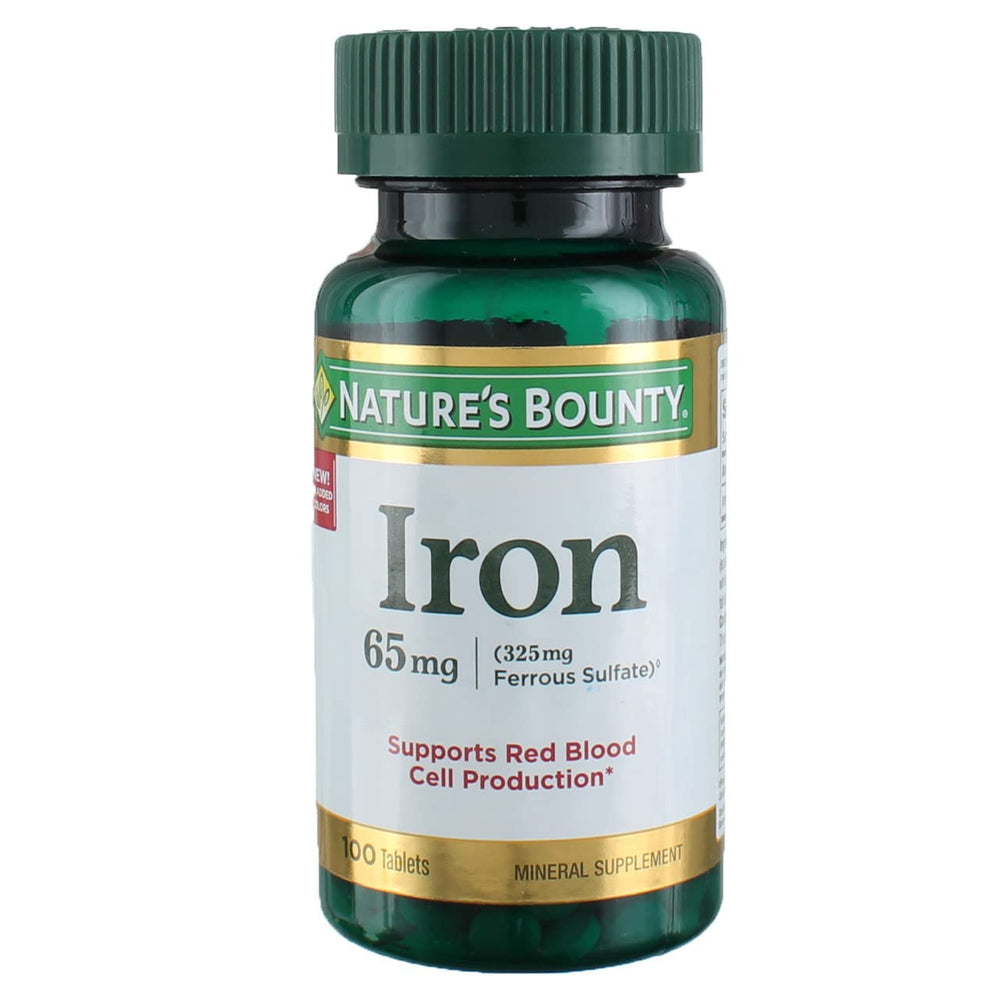 Nature's Bounty Iron 65 mg four-bottle package on a clean surface