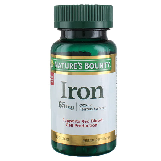 Nature's Bounty Iron 65 mg four-bottle package on a clean surface