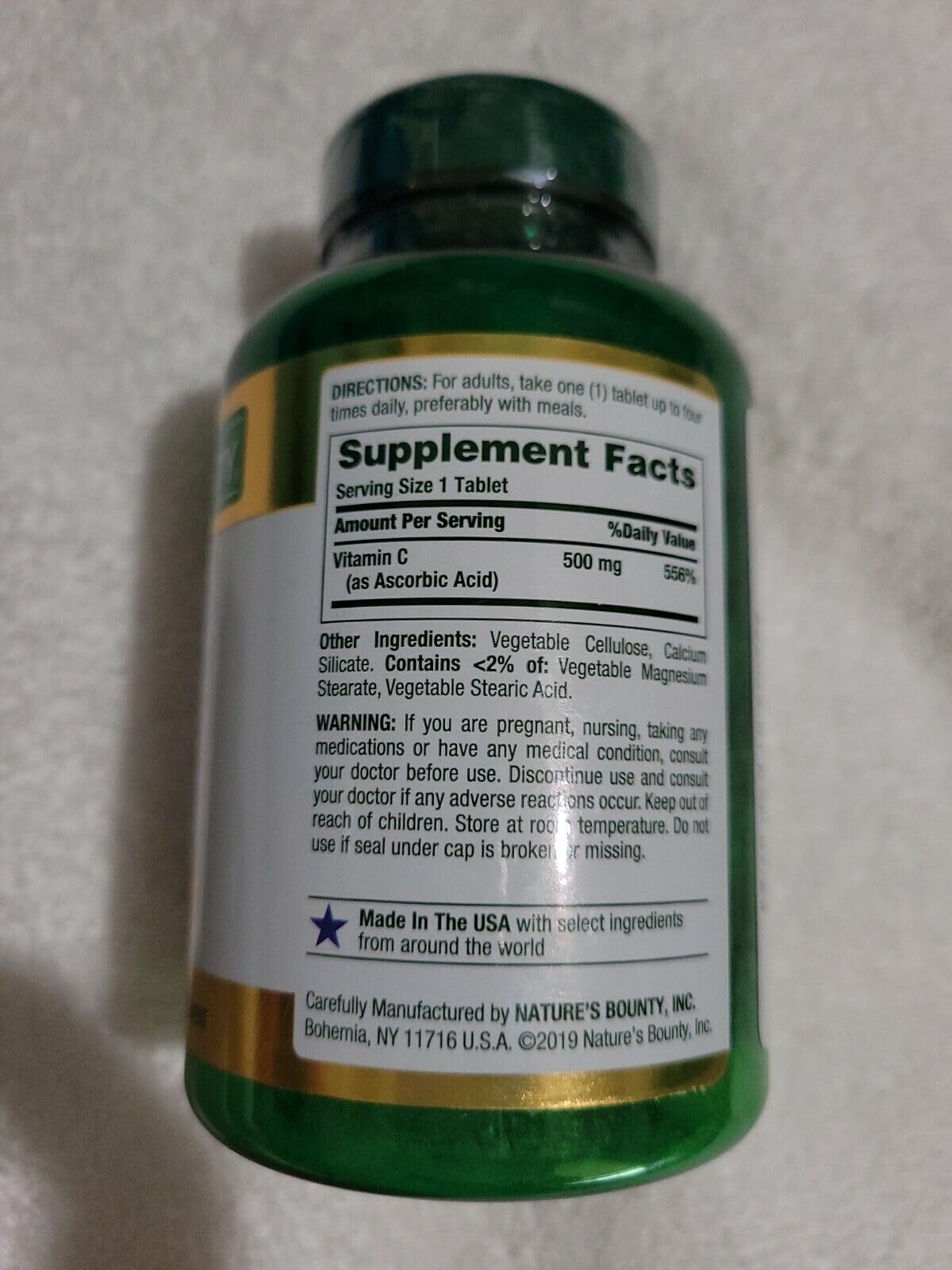 Nature's Bounty Pure Vitamin C caplets bottle label close-up showing ingredients