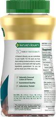 Nature's Bounty Vitamin B12 gummies in hand, easy to chew and enjoy