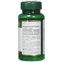 Nature's Bounty zinc caplets pouring shot highlighting dosage amount.