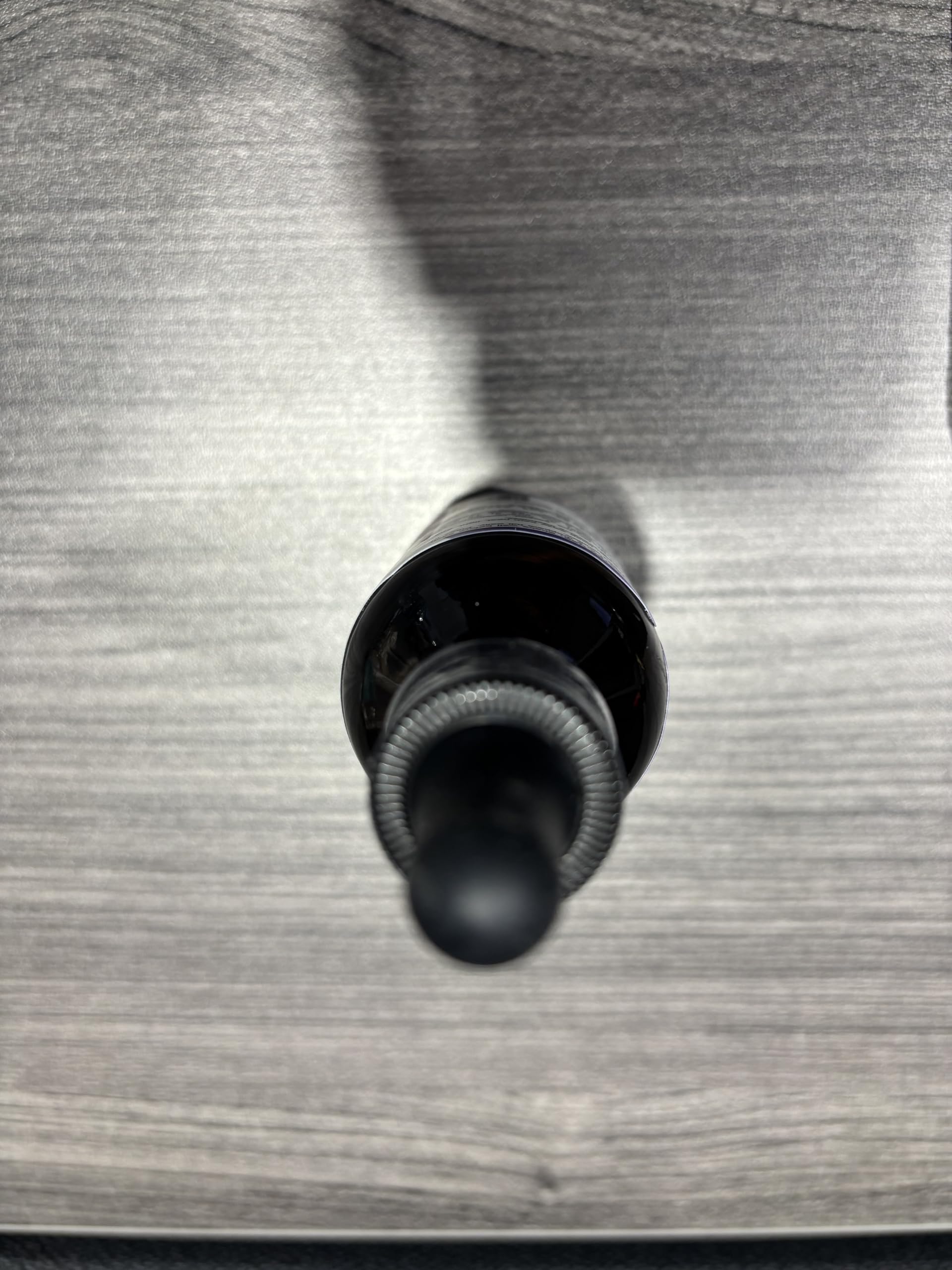 Smooth liquid texture shown in a dosing bottle for easy daily use.