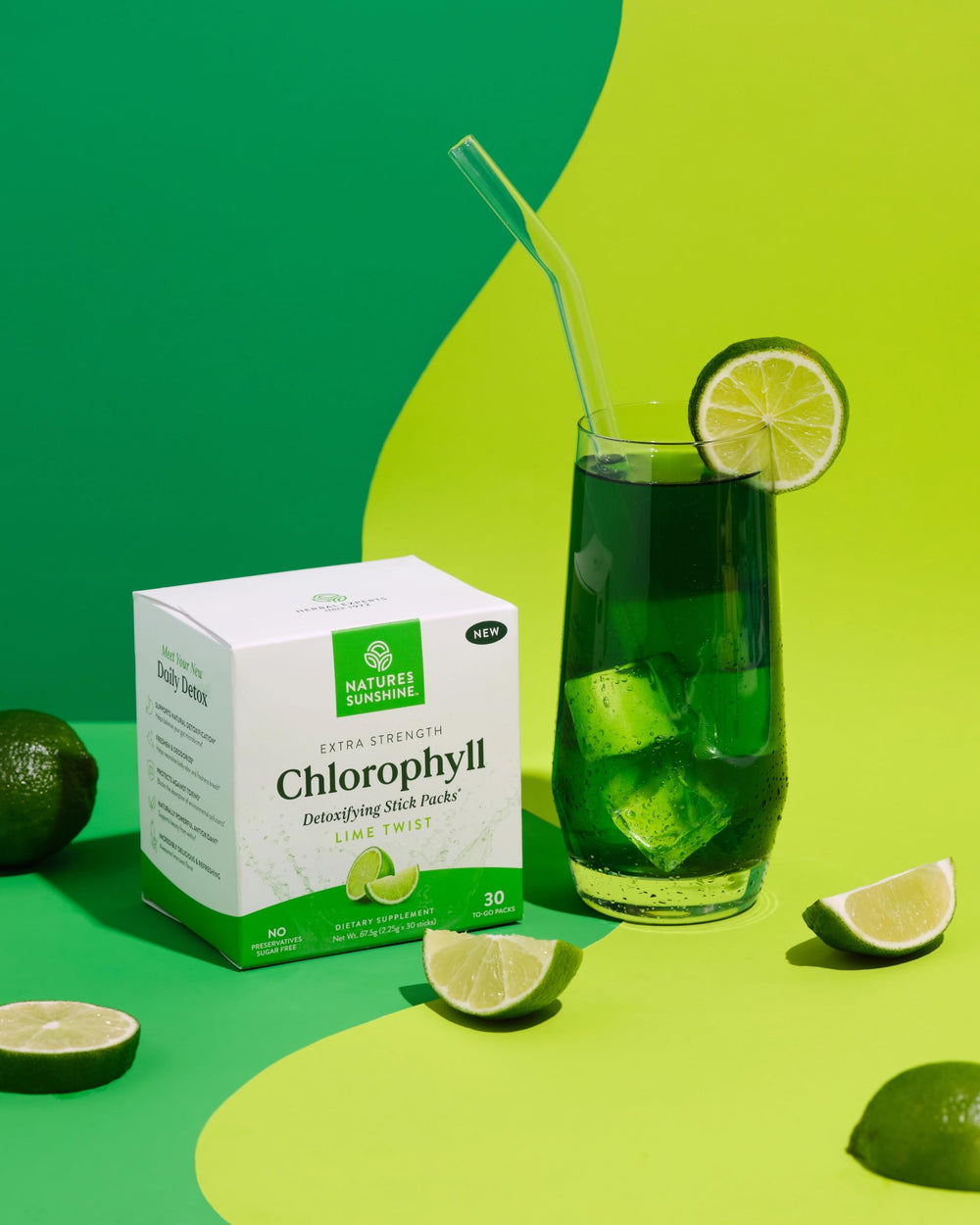Glass of vibrant green chlorophyll drink after mixing Lime Twist.