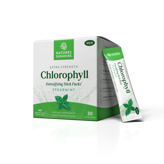 Nature's Sunshine Chlorophyll Stick Packs mixed with water for a refreshing detox drink