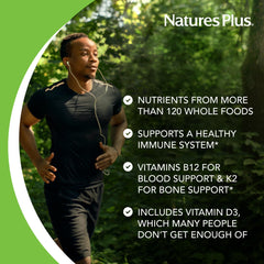 Closeup of NaturesPlus Source of Life GOLD capsules emphasizing whole-food ingredients