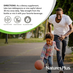 NaturesPlus logo with Source of Life Gold bottle in cozy kitchen lighting
