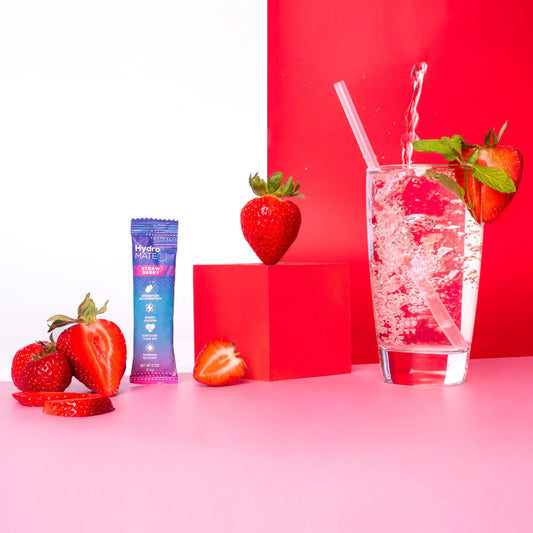NatureWorks HydroMATE strawberry packets flatlay for travel-friendly hydration