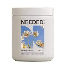 Needed Women’s Multivitamin bottle front with citrus scent insert and daily wellness emphasis
