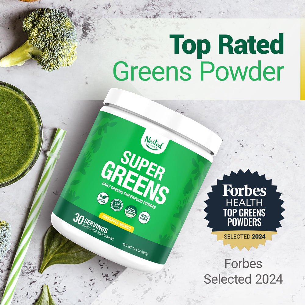 Nested Naturals Super Greens powder poured into a glass for a tropical boost