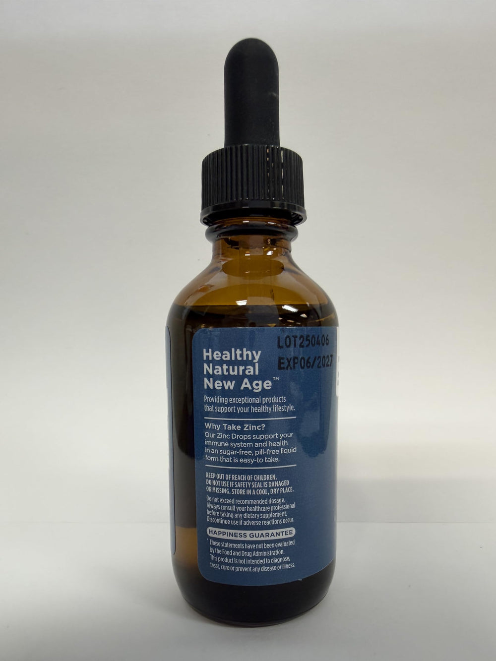 NEW AGE Zinc Drops label close-up emphasizes vegan, gluten-free benefits