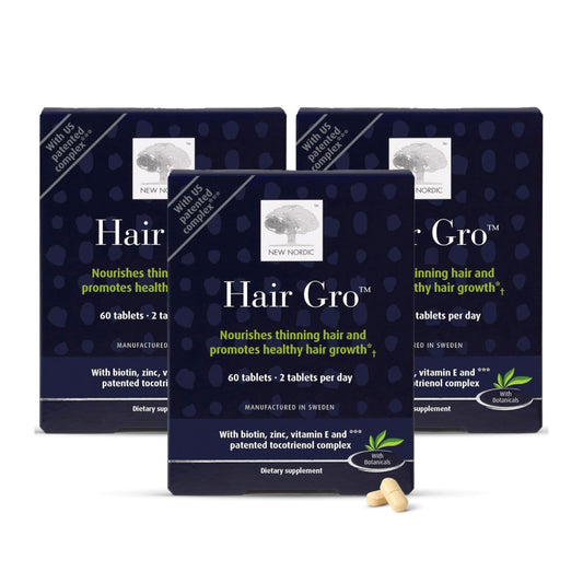 NEW NORDIC Hair GRO bottle closeup showing vegan palm tocotrienol formula for hair support