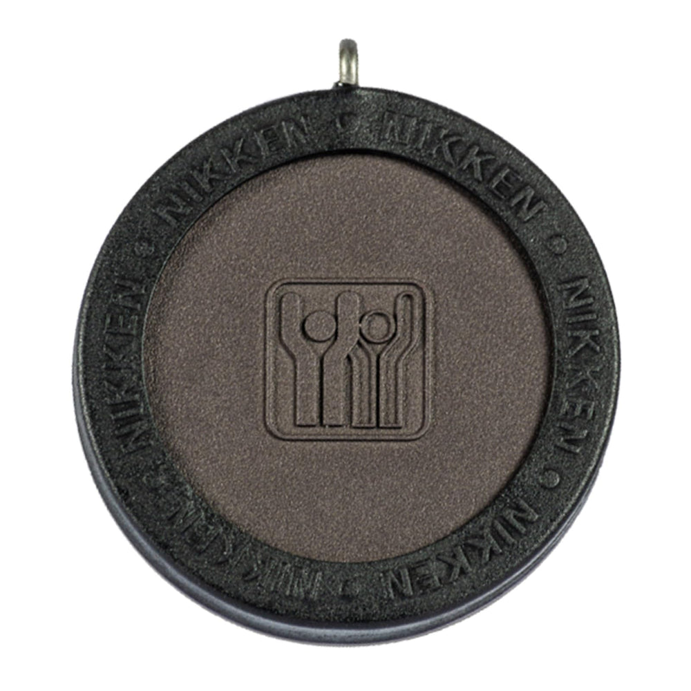Nikken Kenko PowerChip Black front view, compact magnetic chip for daily wear.