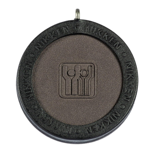 Nikken Kenko PowerChip Black front view, compact magnetic chip for daily wear.