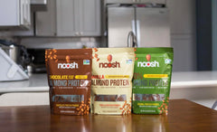 NOOSH almond protein bottle label chocolate highlighting gluten-free, kosher, non-GMO nutrition