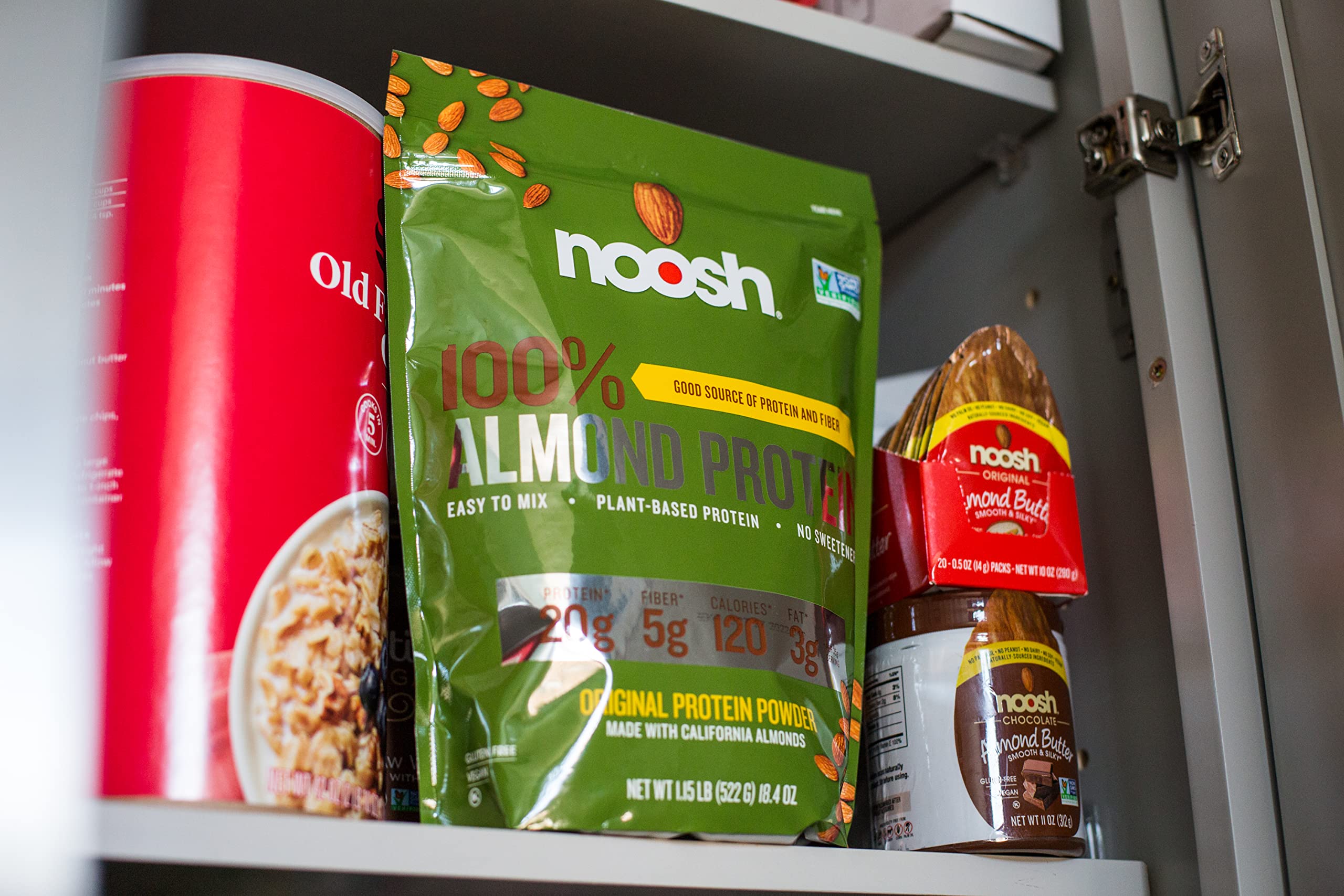 NOOSH almond protein powder with almonds to highlight natural source