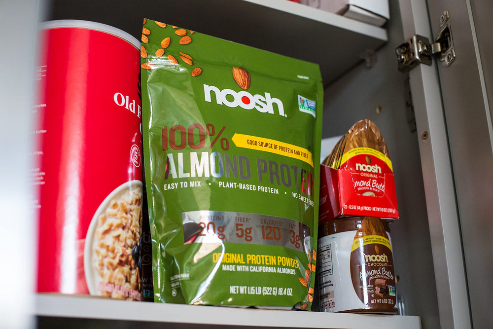 NOOSH almond protein powder with almonds to highlight natural source