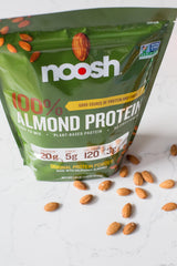 NOOSH certification badges indicate vegan gluten-free non-GMO status