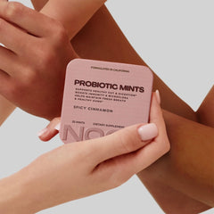 NOOZ Mints beside gym bag illustrating on-the-go digestion and oral care.