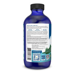Pouring Nordic Naturals Arctic Cod Liver Oil into a spoon for easy use