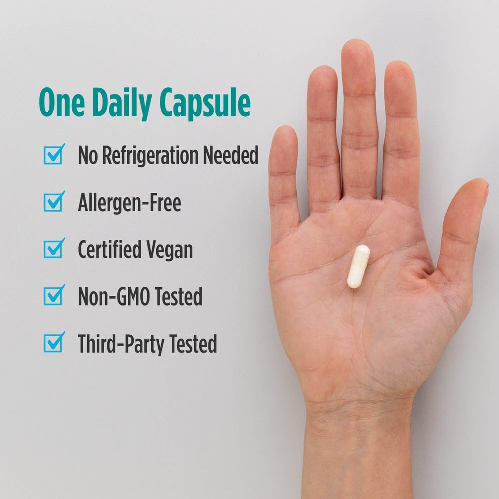 Hands holding Nordic Naturals bottle during routine wellness moment.