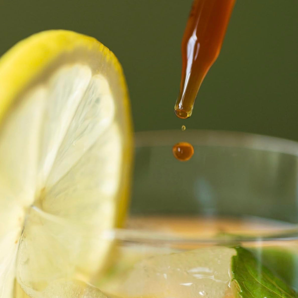 North Spore Chaga tincture pours into coffee or tea for easy integration.