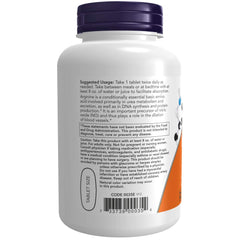 Close-up of NOW L-Arginine tablet illustrating pharmaceutical-grade quality.