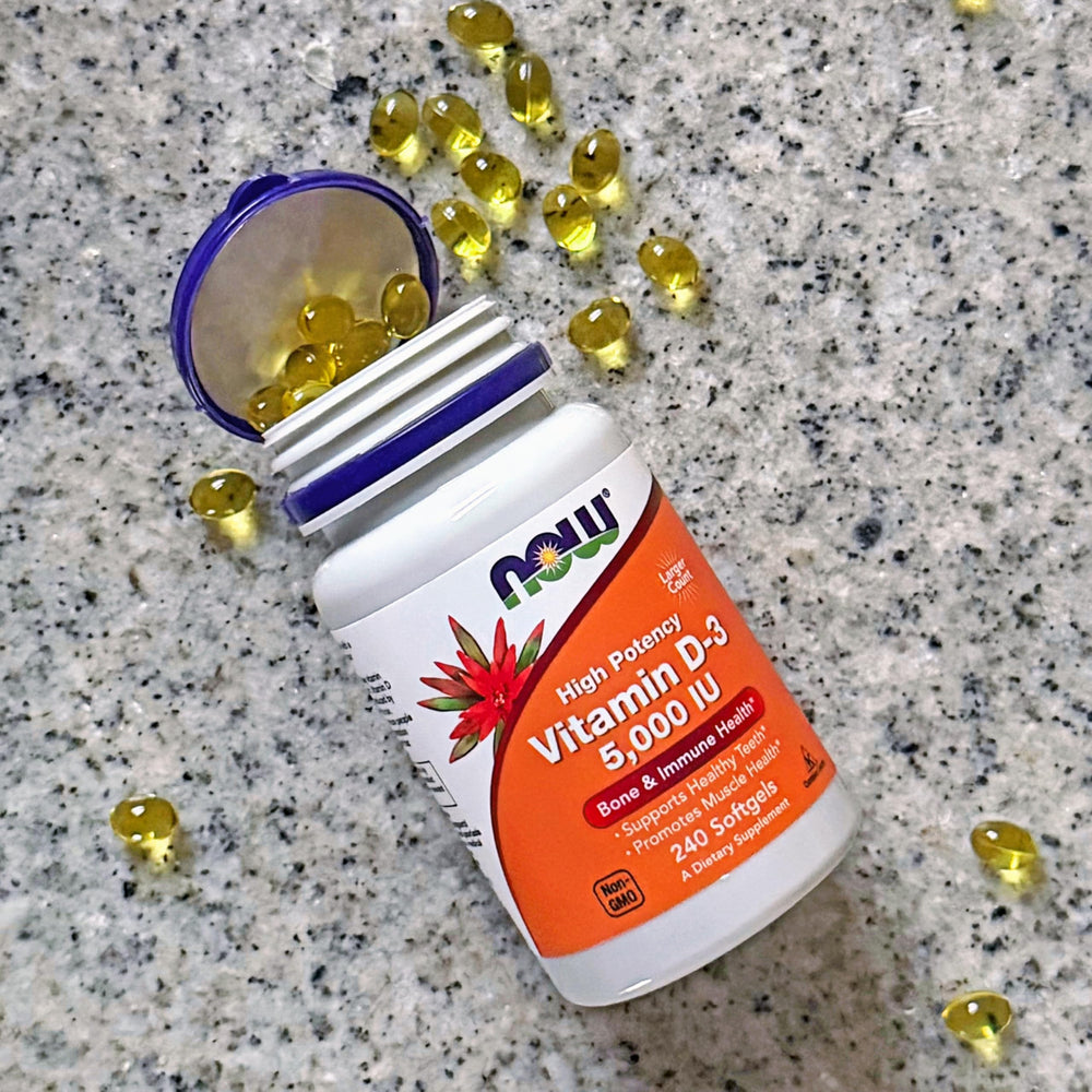 Softgels pour from NOW Foods bottle for easy daily supplementation.