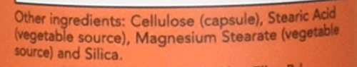 Closeup of Now Foods Turmeric Bromelain capsules showing texture