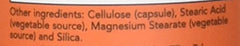 Closeup of Now Foods Turmeric Bromelain capsules showing texture