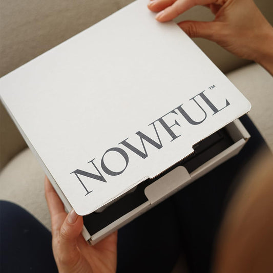 Nowful aromatherapy oil bottle shown for a soothing, restorative moment.