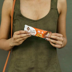 Cross-section of NuGo Slim bar with dark chocolate coating.