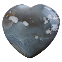 Nupuyai agate heart stone close-up with natural banding for calm meditation.